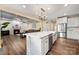 Open-concept kitchen with island, stainless appliances, and adjoins living area with fireplace at 3019 Foggy Hollow Ln, Clover, SC 29710