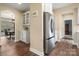 Modern kitchen with stainless steel refrigerator and view into dining area at 3019 Foggy Hollow Ln, Clover, SC 29710