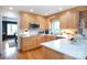 Bright kitchen with wood cabinets, stainless microwave, and a stained-glass window above the sink at 402 Belwood Dr, Belmont, NC 28102