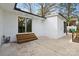 Back exterior featuring steps leading up to the glass sliding door and a small deck at 4913 Seacroft Rd, Charlotte, NC 28210
