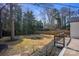 Spacious backyard with mature trees and a wooden fence at 4913 Seacroft Rd, Charlotte, NC 28210