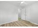 Bright bedroom features modern floors, fresh neutral paint and double door closet at 4913 Seacroft Rd, Charlotte, NC 28210