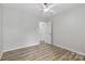 Bright bedroom with lots of natural light, a ceiling fan, and a doorway to a walk-in closet at 4913 Seacroft Rd, Charlotte, NC 28210