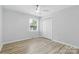 Bedroom featuring a ceiling fan, a window, and a double-door closet for storage at 4913 Seacroft Rd, Charlotte, NC 28210