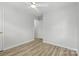 Bright bedroom with a ceiling fan and doorway to another room at 4913 Seacroft Rd, Charlotte, NC 28210