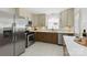 Well-appointed kitchen with stainless steel appliances, updated cabinetry, and stylish backsplash at 4913 Seacroft Rd, Charlotte, NC 28210