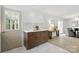 Dining area next to kitchen with quartz counters, and brown shaker cabinetry at 4913 Seacroft Rd, Charlotte, NC 28210