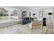 Bright living room with large windows, comfortable seating, and stylish decor at 4913 Seacroft Rd, Charlotte, NC 28210