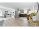 Open-concept layout with living room and kitchen featuring modern appliances and stylish finishes at 4913 Seacroft Rd, Charlotte, NC 28210