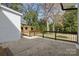 View of the spacious concrete patio surrounded by an elegant wood and painted railing at 4913 Seacroft Rd, Charlotte, NC 28210