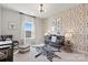 Charming Bedroom with zebra rug, black crib, and playful wallpaper creates a cheerful and inviting space at 5009 Duval Cir, Tega Cay, SC 29708
