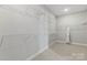 Bright, empty walk-in closet with wire shelving for optimal organization at 5009 Duval Cir, Tega Cay, SC 29708