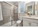 Modern bathroom featuring tiled shower and single sink vanity at 5013 Duval Cir, Tega Cay, SC 29708