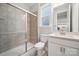 Bathroom with tiled shower, white vanity, and neutral finishes at 5013 Duval Cir, Tega Cay, SC 29708