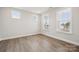 Cozy bedroom featuring natural light, wood floors, and neutral paint at 5013 Duval Cir, Tega Cay, SC 29708