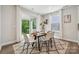 Bright dining area with a modern table setting, overlooking a serene outdoor view at 5013 Duval Cir, Tega Cay, SC 29708