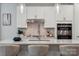 Gourmet kitchen with quartz countertops, stainless steel appliances, and modern pendant lighting at 5013 Duval Cir, Tega Cay, SC 29708