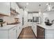 Well-equipped kitchen with white cabinets, stainless steel appliances, and a modern backsplash at 5013 Duval Cir, Tega Cay, SC 29708