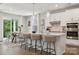 Bright, modern kitchen features white cabinets, quartz countertops, and stainless steel appliances at 5013 Duval Cir, Tega Cay, SC 29708