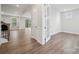 Bright living room with wood floors, natural light, and access to the outdoors at 5013 Duval Cir, Tega Cay, SC 29708
