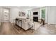 Bright living room with modern decor, fireplace, and large windows at 5013 Duval Cir, Tega Cay, SC 29708