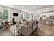 Open-concept living area with modern kitchen, fireplace, and ample seating at 5013 Duval Cir, Tega Cay, SC 29708