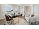Bright office featuring a modern desk, comfortable seating, and large windows at 5013 Duval Cir, Tega Cay, SC 29708