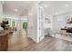 Bright, airy office space with french doors and wood floors opens to the large living and dining spaces at 5013 Duval Cir, Tega Cay, SC 29708
