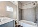 Elegant bathroom featuring a tub and shower combo with stylish tiling and a granite vanity at 508 N Hill St, Dallas, NC 28034