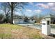 Well-maintained white brick home with a two-car garage and manicured front yard at 523 Belmorrow Dr, Charlotte, NC 28214