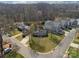 Aerial view of the home showcasing its landscaped yard and surrounding neighborhood at 5300 Buckingham Dr, Charlotte, NC 28209