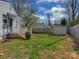 A spacious backyard featuring a shed and a wooden fence, perfect for outdoor activities and privacy at 5300 Buckingham Dr, Charlotte, NC 28209