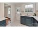 Updated kitchen featuring white countertops, tile floor, and modern sink at 5300 Buckingham Dr, Charlotte, NC 28209