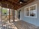 Inviting screened porch featuring wood floors, exterior access, and ample light at 5300 Buckingham Dr, Charlotte, NC 28209