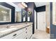 Bathroom with double sink, granite countertop, and a neutral color scheme is both practical and aesthetically pleasing at 6187 Cloverdale Dr, Tega Cay, SC 29708