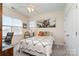 Serene bedroom with natural light, showcasing a comfortable bed and an inviting atmosphere at 6187 Cloverdale Dr, Tega Cay, SC 29708