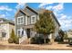 Beautiful two-story home with landscaped front yard, brick accents, and a cozy front porch at 6187 Cloverdale Dr, Tega Cay, SC 29708