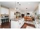 Kitchen with island and barstool seating which is open to the dining and living areas, creating a welcoming open concept layout at 6187 Cloverdale Dr, Tega Cay, SC 29708
