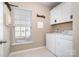 Bright laundry room with modern washer and dryer, providing convenience for household chores at 6187 Cloverdale Dr, Tega Cay, SC 29708