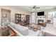 Inviting living room featuring a fireplace, hardwood floors, built-in shelving, and neutral decor at 6187 Cloverdale Dr, Tega Cay, SC 29708