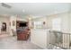 Upstairs living room features plush carpet and a built in wooden media center at 6187 Cloverdale Dr, Tega Cay, SC 29708
