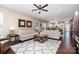 Bright and airy living room featuring hardwood floors, neutral decor, and a ceiling fan at 6187 Cloverdale Dr, Tega Cay, SC 29708