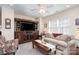 Comfortable living room featuring a wooden media center, large windows and comfortable seating at 6187 Cloverdale Dr, Tega Cay, SC 29708
