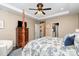 Bedroom with a four-poster bed and ceiling fan, offers a peaceful retreat with ample space and comfort at 6187 Cloverdale Dr, Tega Cay, SC 29708
