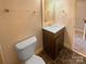 Bathroom featuring modern vanity, dark floors, and classic design at 6436 Old Pineville Rd # C, Charlotte, NC 28217