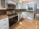 Updated kitchen featuring stainless steel appliances, granite counters, modern cabinetry, and a stylish backsplash at 6436 Old Pineville Rd # C, Charlotte, NC 28217