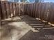 Private outdoor patio area enclosed by a wood fence, perfect for outdoor dining and entertaining at 6436 Old Pineville Rd # C, Charlotte, NC 28217