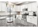 Modern kitchen with white subway tile backsplash, stainless steel appliances, and a granite-topped island at 734 Rocky Grove Gln, York, SC 29745