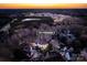 Sunset aerial view of 7924 Pemswood St highlighting the community, surrounding landscape, and neighborhood at 7924 Pemswood St, Charlotte, NC 28277