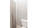 Bathroom featuring a shower and toilet, with light grey coloring at 7924 Pemswood St, Charlotte, NC 28277